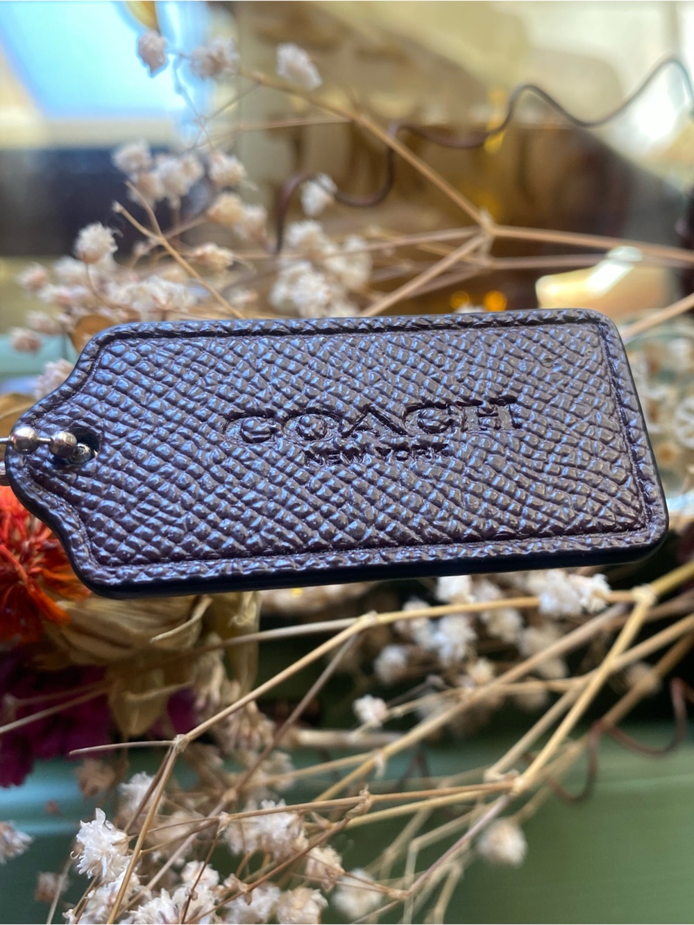 Coach Brown Pebble Leather hangtag